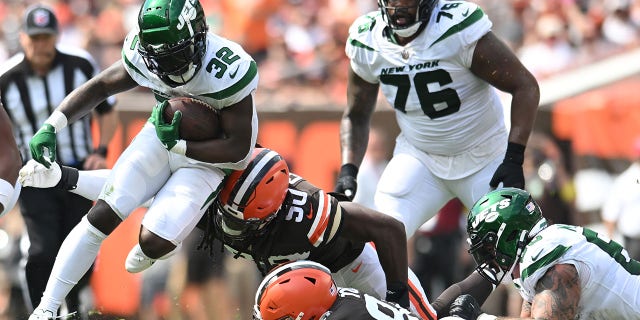 Michael Carter of the New York Jets runs with the ball against the Browns at FirstEnergy Stadium on Sept. 18, 2022, in Cleveland, Ohio.