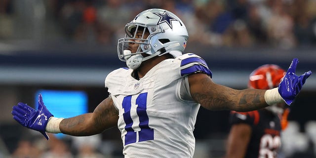 Micah Parsons, #11 of the Dallas Cowboys, reacts after sacking Joe Burrow, #9 of the Cincinnati Bengals (not pictured), during the third quarter at AT&T Stadium on September 18, 2022, in Arlington, Texas. 