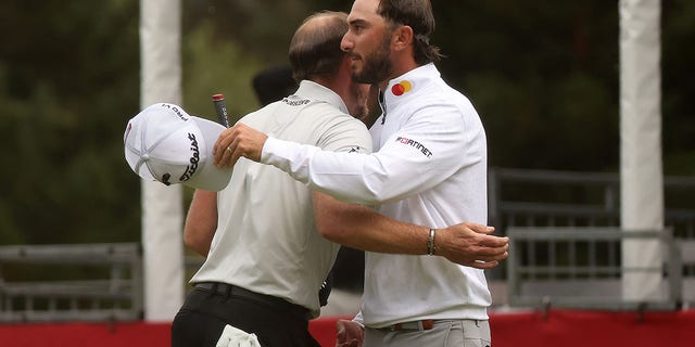 Max Homa of the United States hugs Danny Willett of England after winning the Fortinet Championship at the Silverado Resort and Spa North Course on September 18, 2022 in Napa, California. 