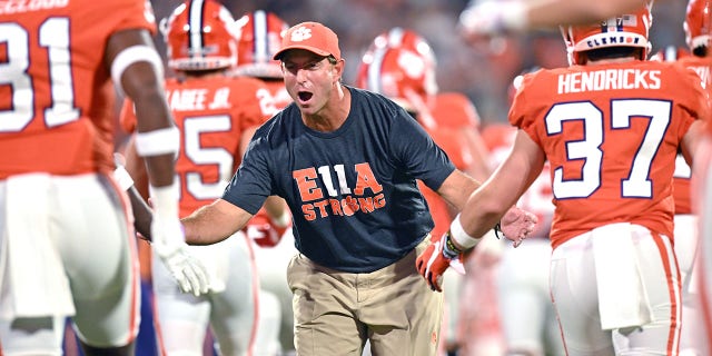 Head coach Dabo Swinney of the Clemson Tigers greets his players as they take the field before their game against the Louisiana Tech Bulldogs at Memorial Stadium on Sept. 17, 2022 in Clemson, South Carolina. 