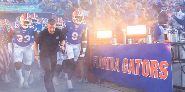 Head coach Billy Napier, of the Florida Gators, takes the field with his team before a game against the South Florida Bulls at Ben Hill Griffin Stadium on Sept. 17, 2022 in Gainesville, Florida. 