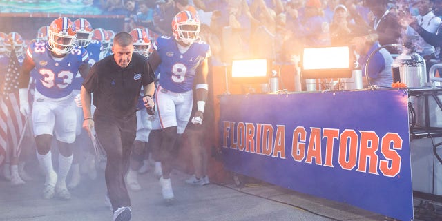 Head coach Billy Napier, of the Florida Gators, takes the field with his team before a game against the South Florida Bulls at Ben Hill Griffin Stadium on Sept. 17, 2022 in Gainesville, Florida. 