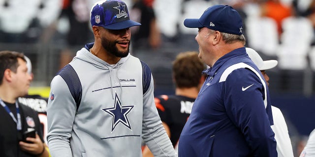 Dallas Cowboys Dak Prescott and head coach Mike McCarthy during the warmup before a Cincinnati Bengals game on September 18, 2022 in Arlington, Texas.