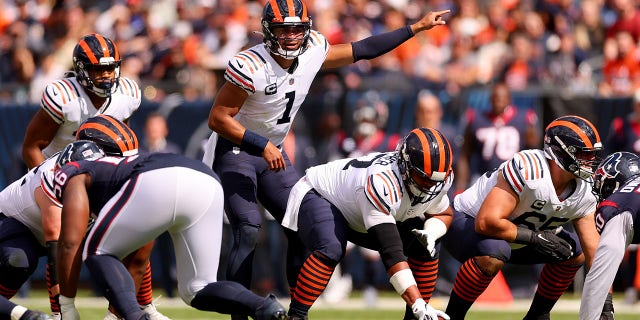 Justin Fields of the Chicago Bears directs the offense against the Houston Texans during the first quarter at Soldier Field in Chicago on Sept. 25, 2022.