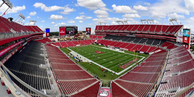 A view of empty seats as players warm up prior to a game between the Green Bay Packers and the Tampa Bay Buccaneers at Raymond James Stadium Sept. 25, 2022, in Tampa, Fla. 