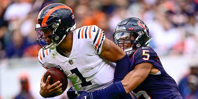 Jalen Pitre of the Houston Texans sacks Justin Fields of the Chicago Bears in the fourth quarter at Soldier Field in Chicago on Sept. 25, 2022.