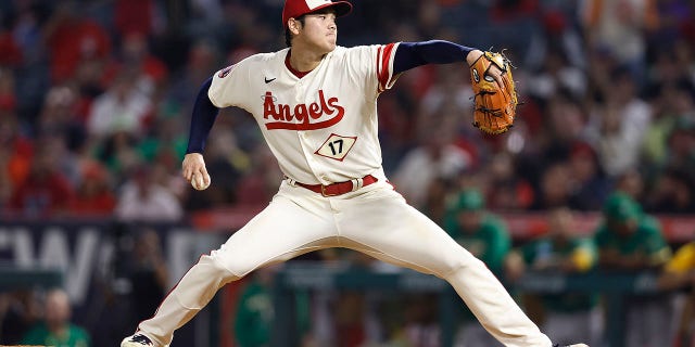 Shohei Ohtani #17 of the Los Angeles Angels pitches against the Oakland Athletics during the eighth inning at Angel Stadium of Anaheim on September 29, 2022, in Anaheim, California. 