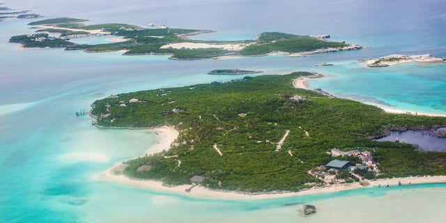 Aerial view of the small atolls, lagoon islands and turquoise waters of the Caribbean Sea of the Exumas seen from an airplane in The Bahamas.