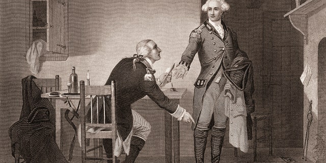 Engraving depicts American army officer Benedict Arnold (1741-1801), seated at a table, as he hands papers to British officer John Andre (1750-1780) during the American Revolutionary War, mid-to-late 18th century. Arnold formally switched sides and joined the British.