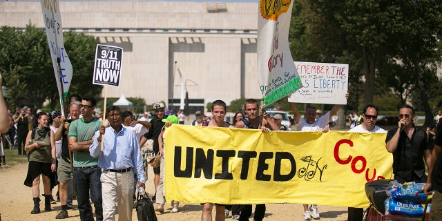 Demonstrators march across the National Mall during the Million American March Against Fear, which was initially called the "Million Muslim March," on Capitol Hill, Sept. 11, 2013, in Washington, D.C.