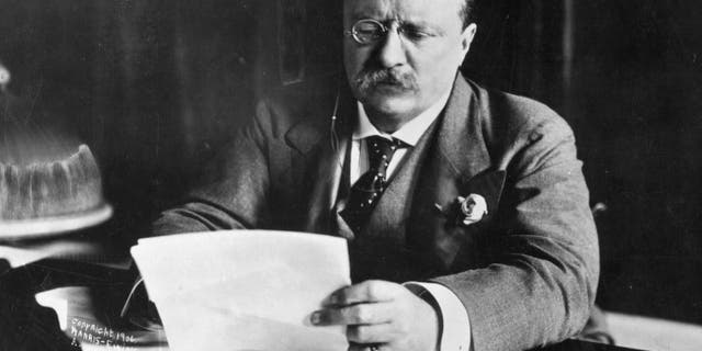 Theodore Roosevelt, the 26th president of the United States (1901-09), is shown working at his desk circa 1905. 