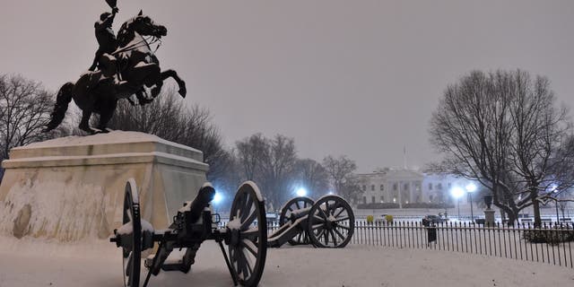Snow covers the statue of president Andrew Jackson in Lafayette Square in front of the White House in Washington, D.C., on Feb. 16, 2015.