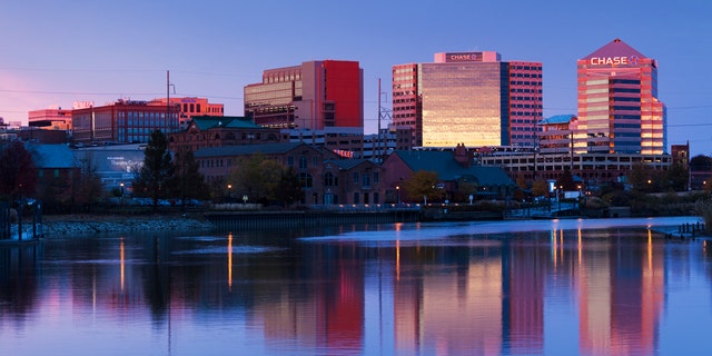Wilmington, Delaware skyline on the Christina River at dusk.