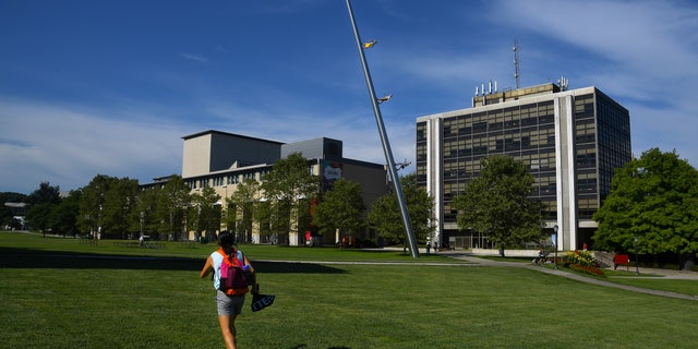  A student walks across The Cut on the campus of Carnegie Mellon University