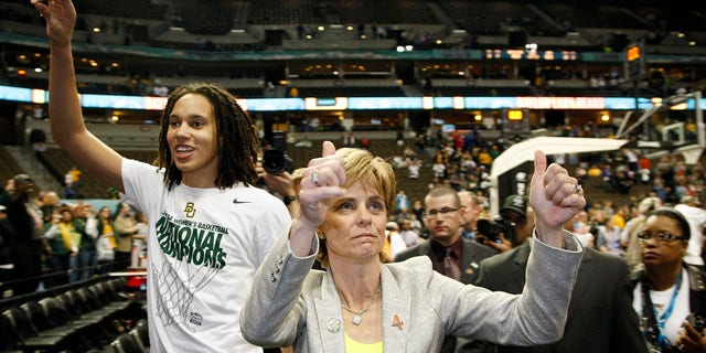 Brittney Griner, #42, and Baylor University head Coach Kim Mulkey celebrate after defeating the University of Notre Dame during the Division I Women's Basketball Championship held at the Pepsi Center in Denver.  Baylor defeated Notre Dame 80-61 to win the national title.  