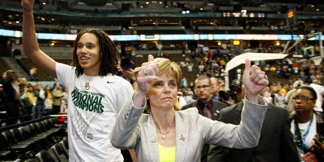 Baylor University's Brittney Griner (42) and head coach Kim Mulkey celebrate after defeating the University of Notre Dame in the Division I Women's Basketball Championship held at the Pepsi Center in Denver, CO.  Baylor beat Notre Dame 80-61 to win the national title.  