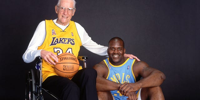 George Mikan from the Minneapolis Lakers, left, poses for a portrait with Shaquille O'Neal of the Los Angeles Lakers during a 2002 photo shoot.