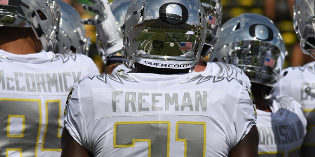 Autzen Stadium is reflected in the helmet of University of Oregon RB Royce Freeman (21) during a college football game between the Nebraska Cornhuskers and the Oregon Ducks on Sept. 9, 2017, at Autzen Stadium in Eugene, Oregon. Nike's innovative University of Oregon uniforms changed the dynamics of sports fashion.