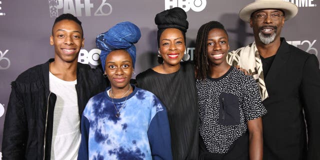 Washington said he enlisted his children to create a greeting video for his film "Corsicana." Washington is pictured with his family in 2018.