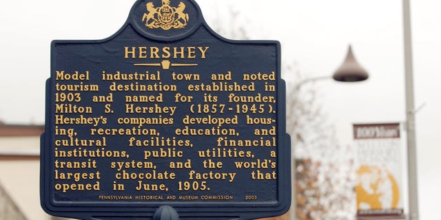 An historic marker stands outside the original Hershey Co. chocolate manufacturing plant in Hershey, Pennsylvania.