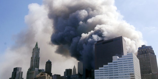 Thick clouds of billowing smoke rise from the scene in Lower Manhattan after the collapse of the World Trade Center towers on Sept. 11, 2001.