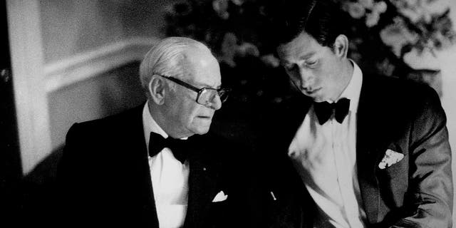 A young Prince Charles eating dinner with American industrialist and philanthropist Armand Hammer, Armie Hammer's great-grandfather.