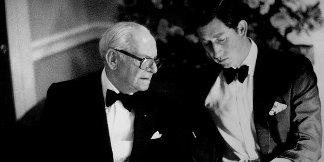 A young Prince Charles eating dinner with American industrialist and philanthropist Armand Hammer, Armie Hammer's great-grandfather.