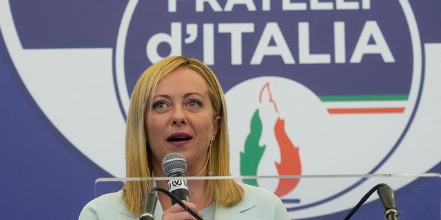 Brothers of Italy's leader Giorgia Meloni speaks to the media at her party's electoral headquarters in Rome, early Monday, Sept. 26, 2022.