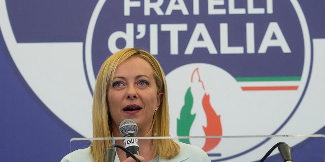 Brothers of Italy's leader Giorgia Meloni speaks to the media at her party's electoral headquarters in Rome, early Monday, Sept. 26, 2022.