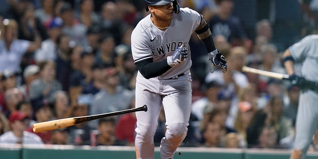 New York Yankees' Gleyber Torres leaves the batter's box after hitting a three-run double against the Boston Red Sox during the 10th inning of a baseball game Tuesday, Sept. 13, 2022, in Boston.