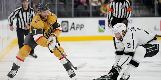 Vegas Golden Knights defenseman Alex Pietrangelo (7) passes around Los Angeles Kings defenseman Alexander Edler (2) during the second period of an NHL preseason hockey game Monday, Sept. 26, 2022, in Las Vegas.