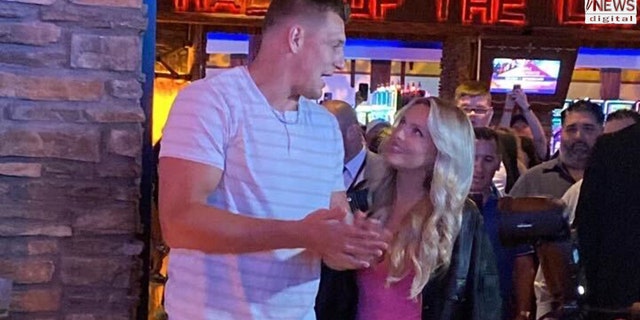 Rob Gronkowski and Camille Kostek pose for photos at Mohegan Sun in Montville, Connecticut.