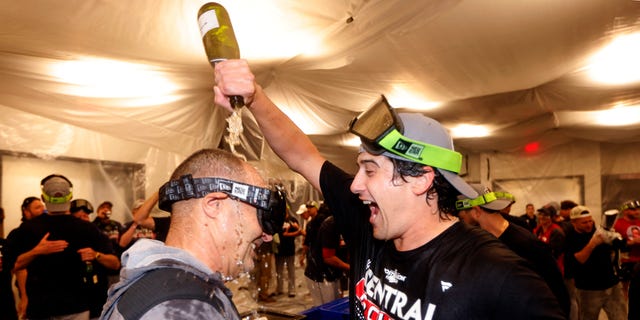 The Cleveland Guardians celebrate after they defeated the Texas Rangers 10-4 and clinched the American League Central Division at Globe Life Field Sept. 25, 2022, in Arlington, Texas.