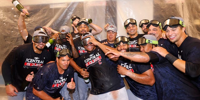 The Cleveland Guardians celebrate after they defeated the Texas Rangers 10-4 and clinched the American League Central Division at Globe Life Field Sept. 25, 2022, in Arlington, Texas.