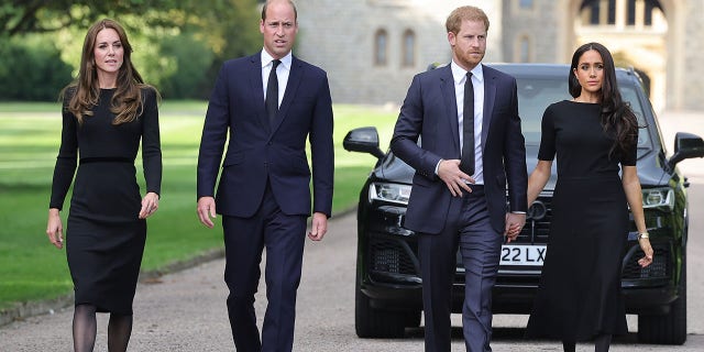 Catherine, Princess of Wales, Prince William, Prince of Wales, Prince Harry, Duke of Sussex, and Meghan, Duchess of Sussex on the long Walk at Windsor Castle arrive to view flowers and tributes to HM Queen Elizabeth on September 10, 2022 in Windsor, England. Crowds have gathered and tributes left at the gates of Windsor Castle to Queen Elizabeth II, who died at Balmoral Castle on 8 September, 2022. 