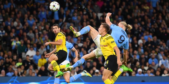 Erling Haaland of Manchester City scores against Dortmund at Etihad Stadium in Manchester, England, on Sept. 14, 2022.