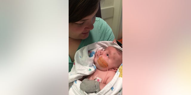 Mom Ellyn Waler holds baby Maverick in her arms. The parents found out about their son's heart condition from ultrasounds before he was born.