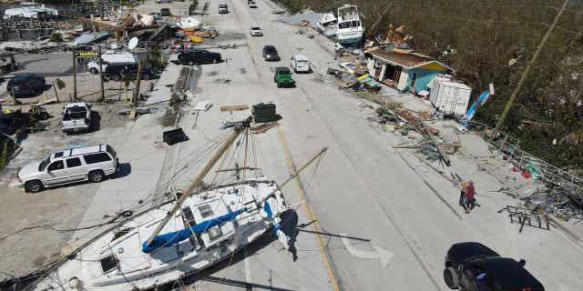 Displaced boats lie strewn along the San Carlos Boulevard, one day after the passage of Hurricane Ian, in Fort Myers Beach, Fla., Thursday, Sept. 29, 2022. 