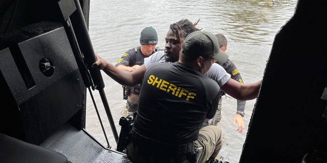 First responders in Orange County, Florida assist those stranded in the aftermath of Hurricane Ian.