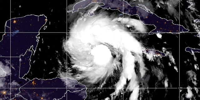 This satellite image provided by the National Oceanic and Atmospheric Administration shows Tropical Storm Ian over the central Caribbean on Monday, Sept. 26, 2022.