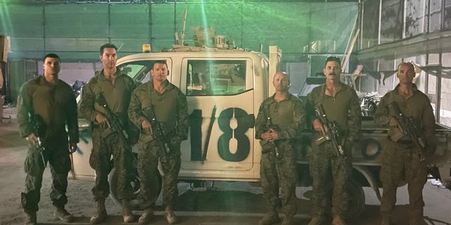 Retired Marine gunner William Callen stands alongside fellow soldiers the morning before departure from the Hamid Karzai International Airport in August 2021.