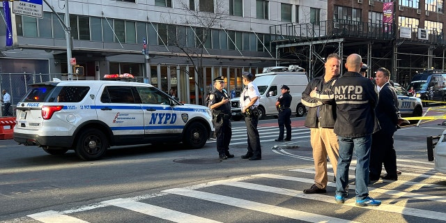 NYPD at the scene where a 25-year-old woman was found shot dead in the head.