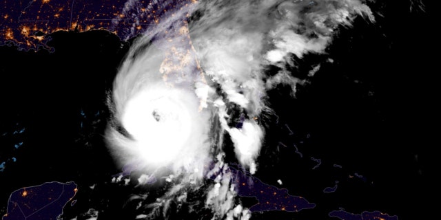 This GOES-East GeoCcolor satellite image taken at 12:41 a.m. EDT on Wednesday, Sept. 28, 2022, and provided by the National Oceanic and Atmospheric Administration (NOAA), shows Hurricane Ian over the Gulf of Mexico.