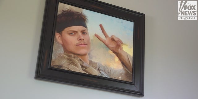 Mark says hello and good night to this painting of Jared every day.  This is a rendition of the Marine's last photo, taken the day he was killed.