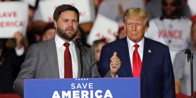Former President Donald Trump welcomes JD Vance, the Republican nominee for U.S. Senator for Ohio, to the podium at a campaign rally in Youngstown, Ohio, on Sept. 17, 2022.