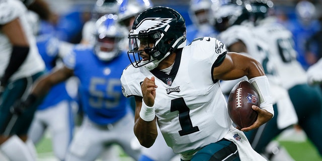Philadelphia Eagles quarterback Jalen Hurts, #1, runs the ball against the Detroit Lions in the first half of an NFL football game in Detroit, Sunday, Sept. 11, 2022.