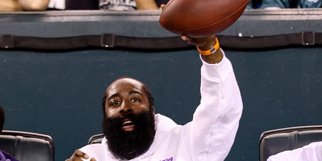 Philadelphia 76ers' James Harden reacts with a game ball during the third quarter between the Philadelphia Eagles and Minnesota Vikings at Lincoln Financial Field on September 29. died on February 19, 2022 in Philadelphia.
