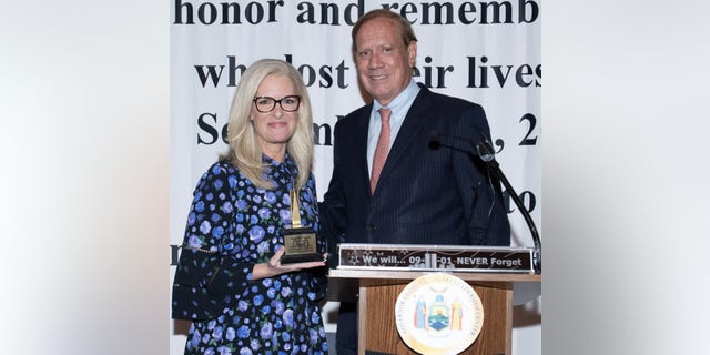 Fox News senior meteorologist Janice Dean receives the Freedom Award from former New York Gov. George Pataki