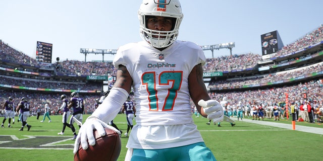 Wide receiver Jaylen Waddle, #17 of the Miami Dolphins, celebrates after capturing the first touchdown lane against the Baltimore Ravens at M&T Bank Stadium on September 18, 2022 in Baltimore.
