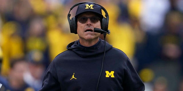 Michigan head coach Jim Harbaugh watches in the first half of an NCAA college football game against Maryland in Ann Arbor, Mich., Saturday, Sept. 24, 2022.